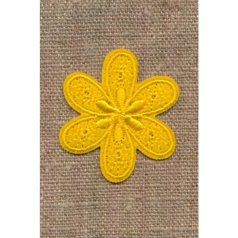 Motiv med blomst i gul