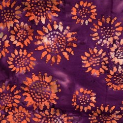 Bomulds poplin batik i cerisse og lilla med orange solsikke