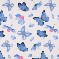 Bomuldsjersey økotex m/digitalt tryk i hvid med blå sommerfugle
