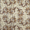 Afklip Viscose elasthan med blomst i okker, 100 cm.