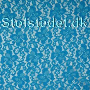 Fast blonde med blomster og let glimmer i turkis - Div. Blonder