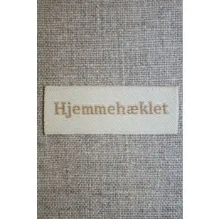 Beige mærke - label "Hjemmehæklet" - Diverse mærker