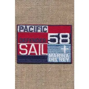 Strygemærke i rød blå denim "Pacific Defender Sail" - Diverse mærker