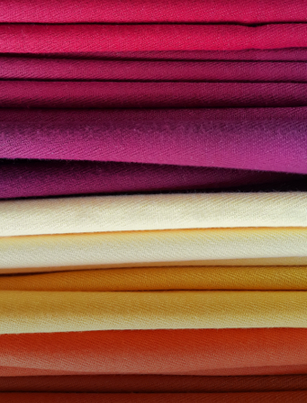 bright-multicolored-background-of-fabrics-WNFMFRX